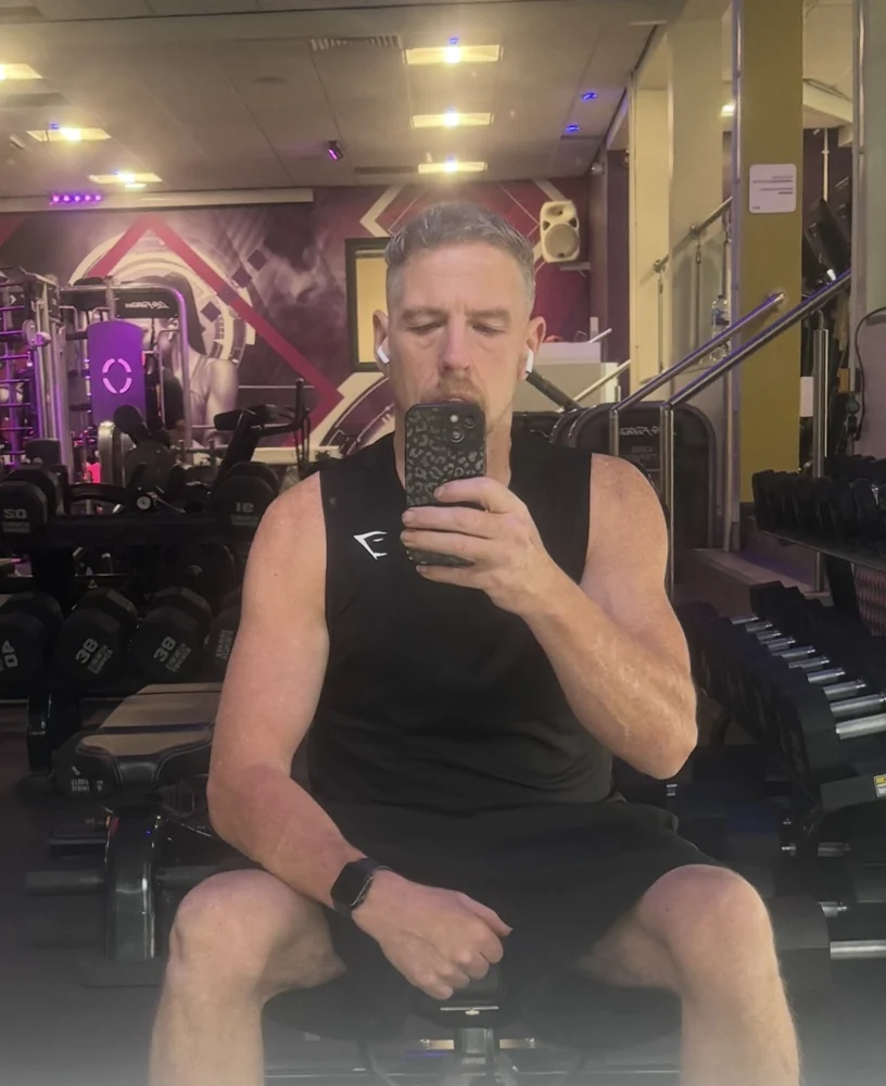 Aaron in the gym during his muscle-building journey