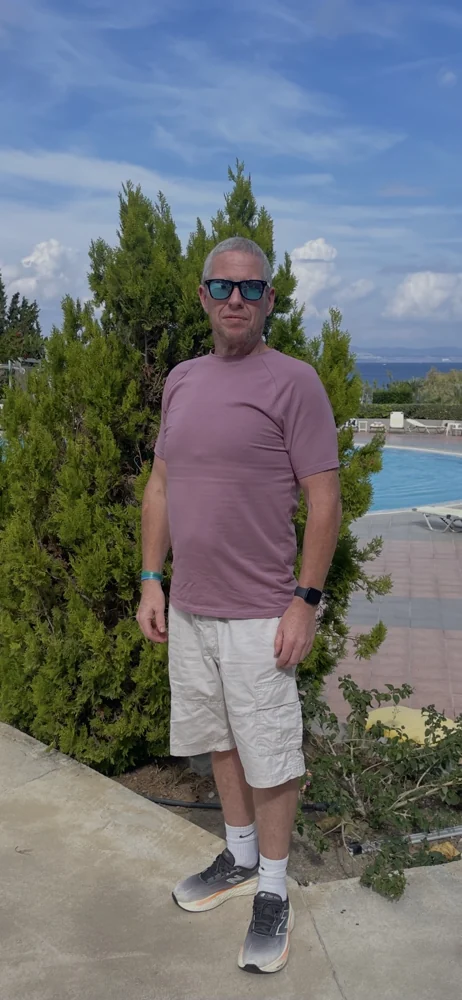 Aaron on holiday after losing weight
