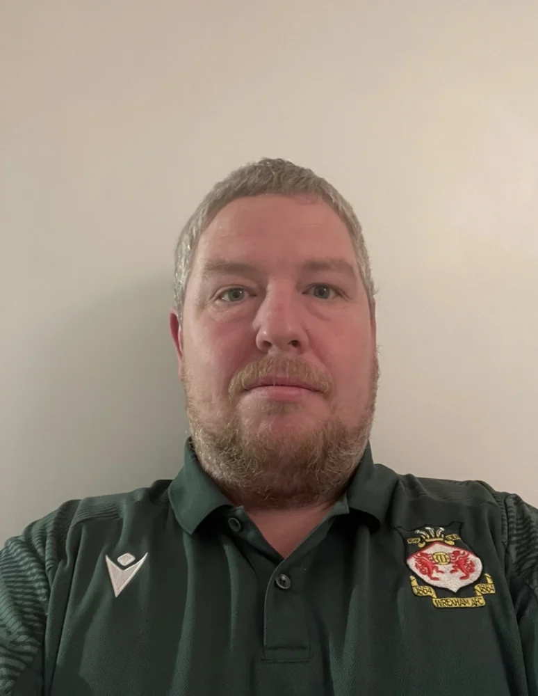Aaron at the start of his journey in a green football shirt